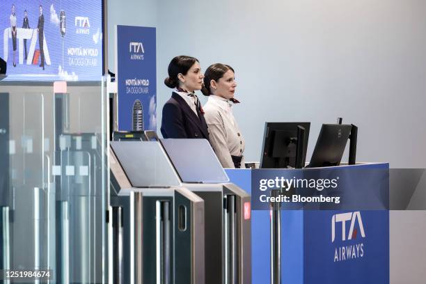 Ground crew members wear uniforms designed by Brunello Cucinelli during the launch of a new Airbus A320neo passenger aircraft, operated by ITA...