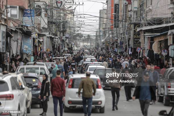 People do shopping at a bazaar prior to the Eid al-fitr in Gaza City, Gaza on April 19, 2023.