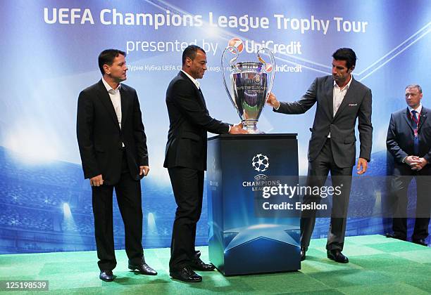 Dmitri Alenichev, Cafu, Luis Figo with a Trophy before a press conference during the UEFA Champions League Trophy Tour 2011 on September 16, 2011 in...