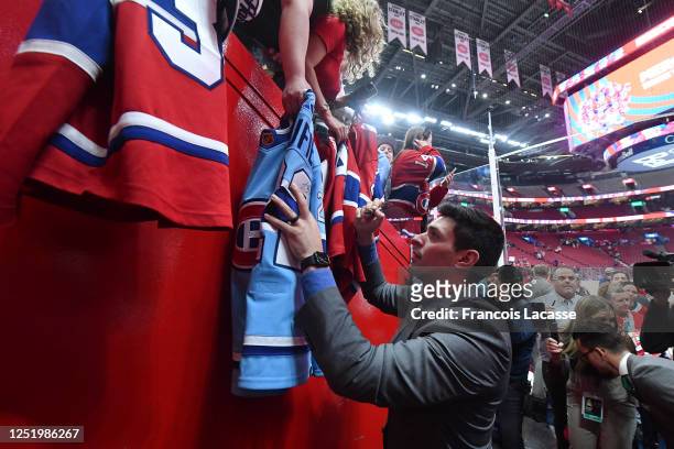 Carey Price of the Montreal Canadiens signs autographs for fans after the NHL game against the Boston Bruins at the Centre Bell on April 13, 2023 in...