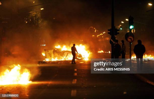 Youths clash with riot police in central Athens during a night of riots on December 08, 2008. Fury at the fatal police shooting of a schoolboy,...