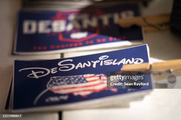 Stickers and apparel promoting Florida Governor Ron DeSantis sit on a table before a book tour event at the North Charleston Coliseum on April 19,...