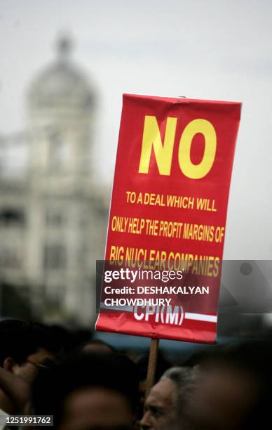 Communist Party of India activists hold placards as they take part in a march against a controversial nuclear pact in Kolkata on July 10, 2008. A...