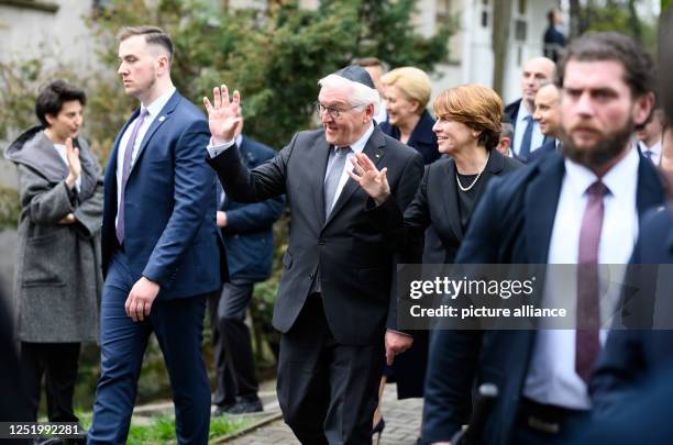 April 2023, Poland, Warschau: German President Frank-Walter Steinmeier and his wife Elke Büdenbender leave the Nozyk Synagogue after the memorial...