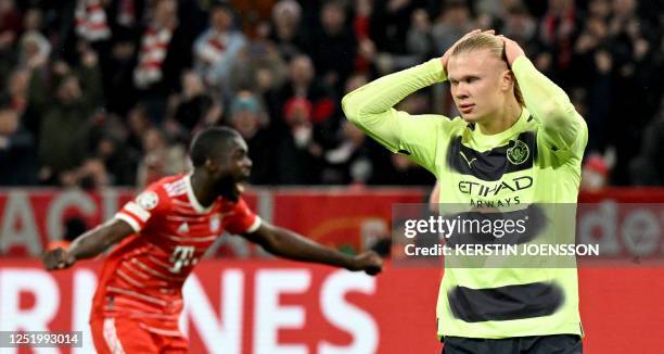 Manchester City's Norwegian striker Erling Haaland reacts after he missed to score a penalty during the UEFA Champions League quarter-final, second...