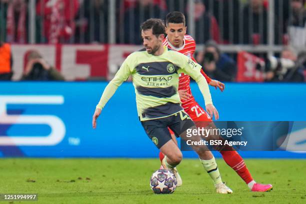 Bernardo Silva of Manchester City battles for the ball with Joao Cancelo of FC Bayern Munchen during the UEFA Champions League Quarterfinal Second...