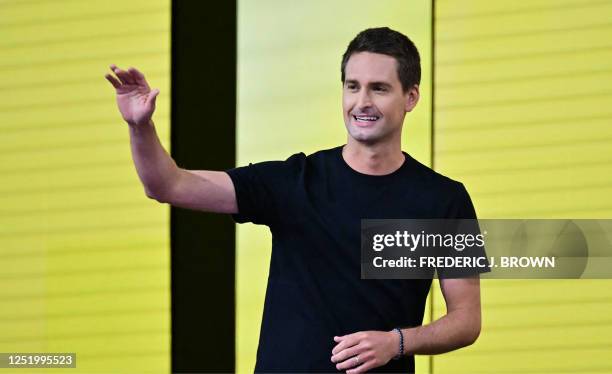 Evan Spiegel, founder and CEO of Snapchat, gestures while speaking at the 2023 Snap Partner Summit at the Barker Hangar in Santa Monica, California,...