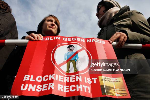 Left-wing anti-racist protestors hold a placard which reads "Berlin against nazis - We have a right to block" against the visit of Dutch right-wing...