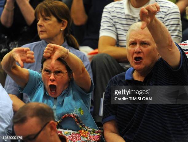 People against health care reform react during a town hall meeting on "Healthcare Reform Efforts" sponsored by US Rep. James Moran, D-VA, on August...
