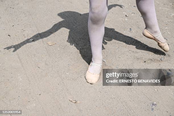 Ballet student performs at the San Genaro neighborhood in the Chorrillos district, south of Lima, on April 1, 2023. - At an arid and dry hill in...