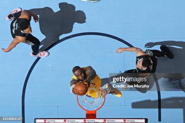 LeBron James of the Los Angeles Lakers dunks the ball during the game against the Memphis Grizzlies during Round One Game Two of the 2023 NBA...