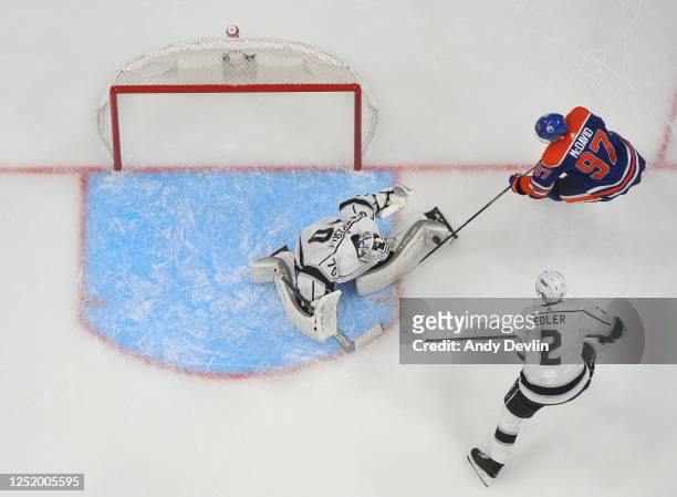 Joonas Korpisalo of the Los Angeles Kings makes a save against Connor McDavid of the Edmonton Oilers in Game Two of the First Round of the 2023...