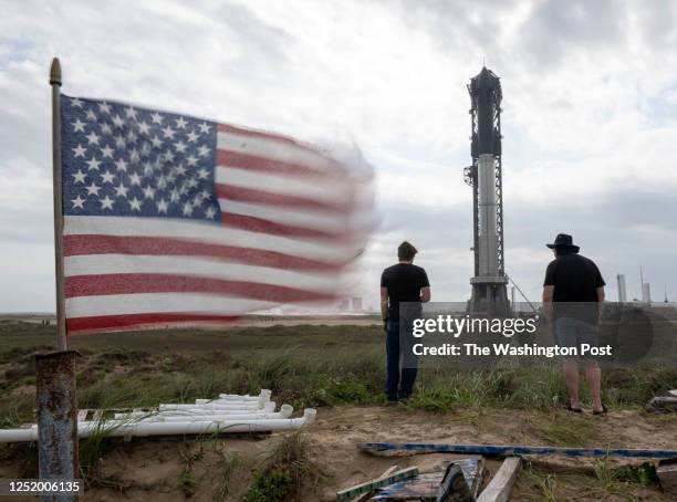 Space fans walk the dunes as workers prepare the SpaceX's Starship spacecraft and Super Heavy rocket as they attempt to schedule another launch...