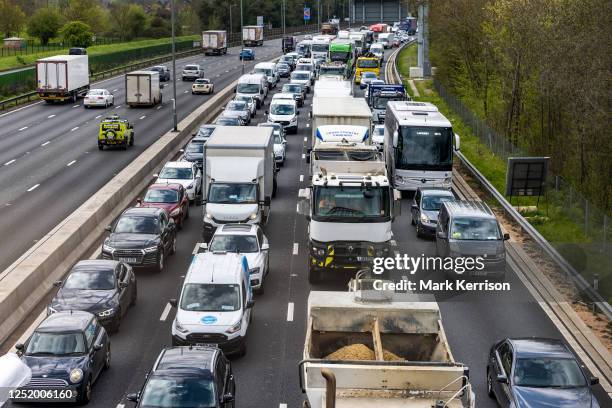 Vehicles pass along a recently completed section of the M4 smart motorway on 19 April 2023 in Slough, United Kingdom. The government has announced...