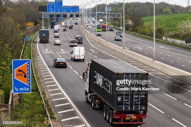 Vehicles pass along a recently completed section of the M4 smart motorway on 19 April 2023 in Slough, United Kingdom. The government has announced...