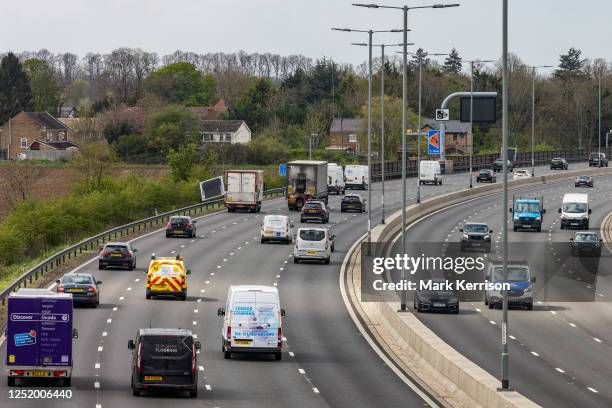 Vehicles pass along a recently completed section of the M4 smart motorway on 19 April 2023 in Slough, United Kingdom. The government has announced...