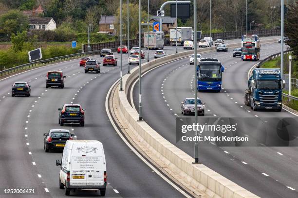 Vehicles pass along a recently completed section of the M4 smart motorway on 19 April 2023 in Slough, United Kingdom. The government has announced...