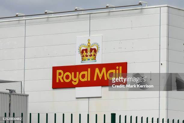 The Royal Mail logo is pictured on the exterior of a distribution centre building on 19 April 2023 in Slough, United Kingdom. Royal Mail provides...