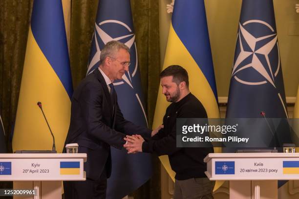 Ukrainian President Volodymyr Zelensky and Secretary General of NATO Jens Stoltenberg shake hands after a joint press conference on April 20, 2023 in...