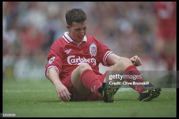 Robbie Fowler of Liverpool grimices in pain during the Premier League match between Liverpool and Sunderland at Anfield in Liverpool. Mandatory...