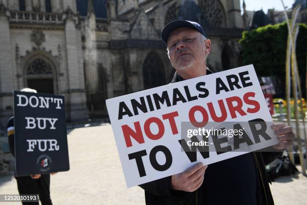 Animal rights activists from the Collectif SIPE and the Coalition to Abolish Fur Trade hold a rally to protest against the use of animal fur near the...