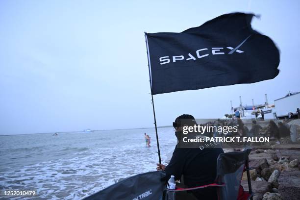 Spectator on South Padre Island, Texas, waits for the launch of the SpaceX Starship for a flight test from Starbase in Boca Chica, Texas, on April...
