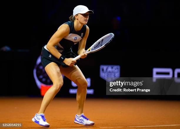 Iga Swiatek of Poland in action against Qinwen Zheng of China during the second round of the Porsche Tennis Grand Prix Stuttgart 2023 at Porsche...