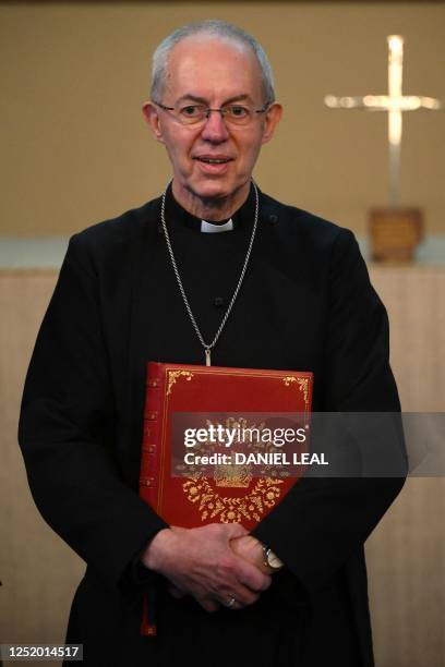 The Archbishop of Canterbury Justin Welby poses with the Coronation Bible, a specially commissioned Bible which will be used during the Coronation...