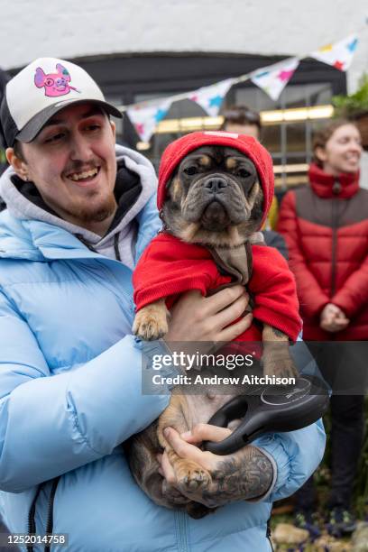 Alex and his French Bulldog Millie-May joined mourners gathered outside the Walnut Tree Inn in Aldington to pay respects to Paul O'Grady, the much...