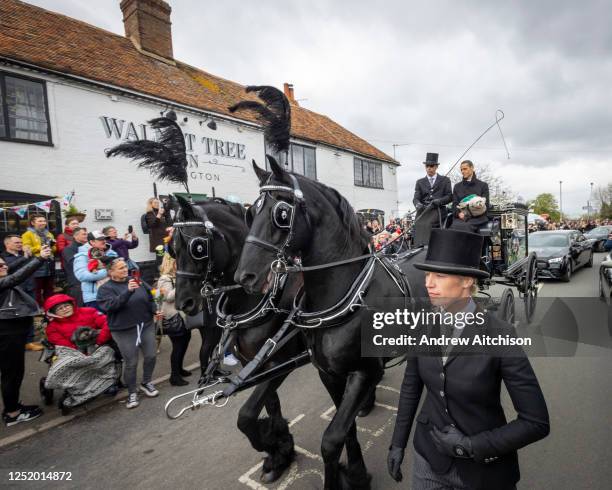 Paul O'Gradys husband Andre Portasio and their pet dog led the funeral procession sitting on the front of the horse drawn hearse through Aldington,...