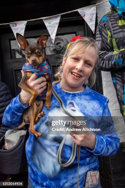 Zeus, the Russian Toy Terrier and his owner Fleur joined mourners gathered outside the Walnut Tree Inn in Aldington to pay respects to Paul O'Grady,...