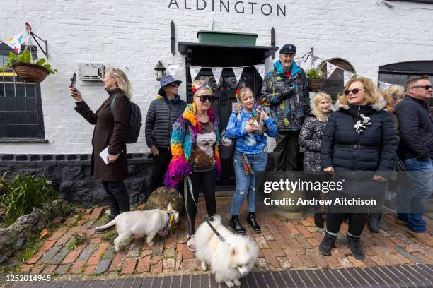 Dogs and mourners gather outside the Walnut Tree Inn in Aldington to pay their respects to Paul O'Grady, the much loved dog lover and TV personality...