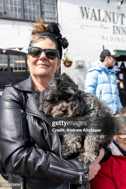 Orla, the ShitPoo joined mourners gathered outside the Walnut Tree Inn in Aldington to pay respects to Paul O'Grady, the much loved TV personality...