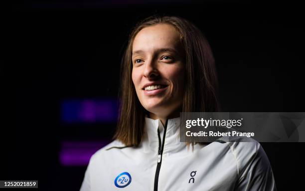 Iga Swiatek of Poland talks to the media after defeating Qinwen Zheng of China in the second round of the Porsche Tennis Grand Prix Stuttgart 2023 at...