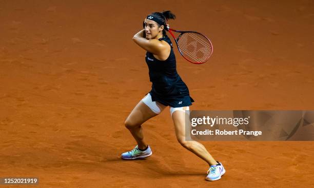 Caroline Garcia of France in action against Tatjana Maria of Germany in the second round of the Porsche Tennis Grand Prix Stuttgart 2023 at Porsche...