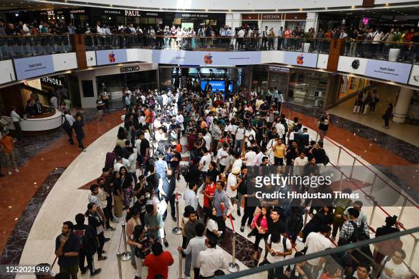 Customers wait in line outside the new Apple Inc. Store ahead of its opening at Select City Walk , at Saket, on April 20, 2023 in New Delhi, India....
