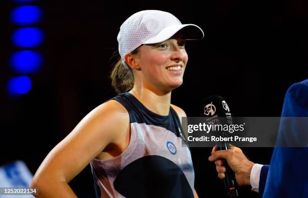 Iga Swiatek of Poland during a post-match interview after defeating Qinwen Zheng of China in the second round of the Porsche Tennis Grand Prix...