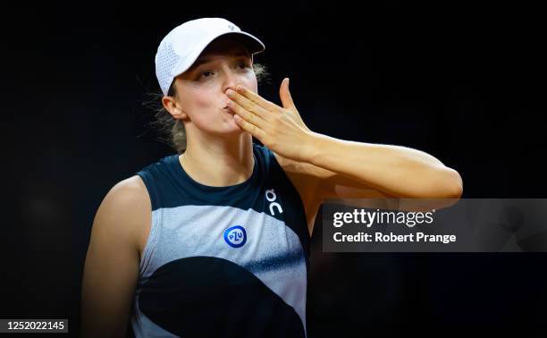 Iga Swiatek of Poland celebrates defeating Qinwen Zheng of China in the second round of the Porsche Tennis Grand Prix Stuttgart 2023 at Porsche Arena...