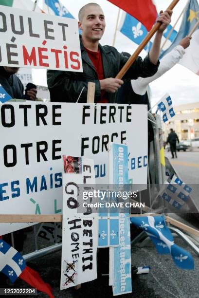 Protester demonstrates outside of the Canadian Museum of Civilization 13 October 2002 at a gala dinner in honor of Britain's Queen Elizabeth II in...