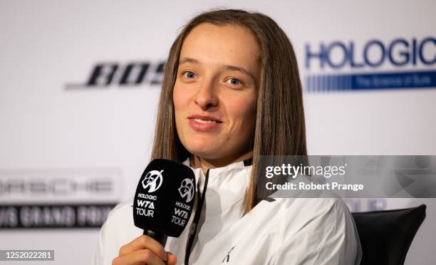 Iga Swiatek of Poland talks to the media after defeating Qinwen Zheng of China in the second round of the Porsche Tennis Grand Prix Stuttgart 2023 at...