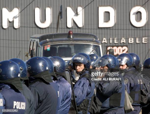 Anti-riot police blockade the entrance of La Noira bridge which connects Buenos Aires province to the capital, in an effort to stop protestors from...