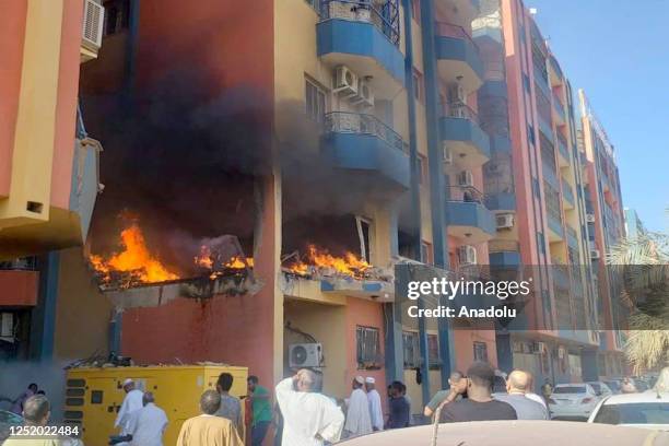 View of the area as a fire broke out after a house was hit in the Lamab district during clashes between the Sudanese Armed Forces and the...