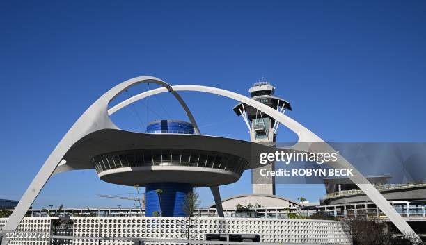 The Theme building, home of the now closed Encounter restaurant, in seen in front of LAX air traffic control tower at Los Angeles International...