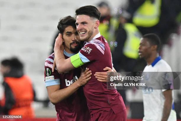 West Ham United's English midfielder Declan Rice celebrates with West Ham United's Brazilian midfielder Lucas Paqueta after scoring their third goal...