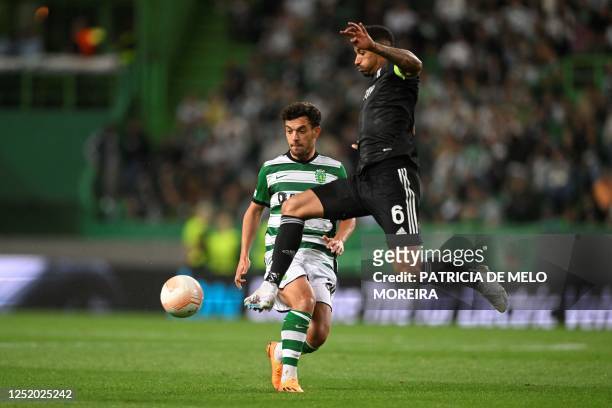 Sporting Lisbon's Portuguese midfielder Pedro Goncalves vies with Juventus' Brazilian defender Danilo during the UEFA Europa league quarter final...