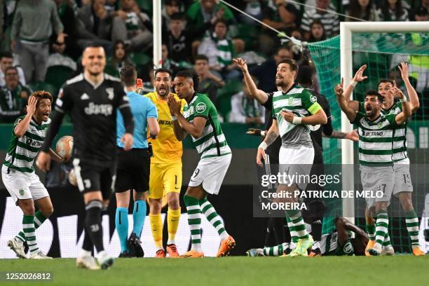 Sporting's players react next to the referee during the UEFA Europa league quarter final second leg football match between Sporting CP and Juventus...