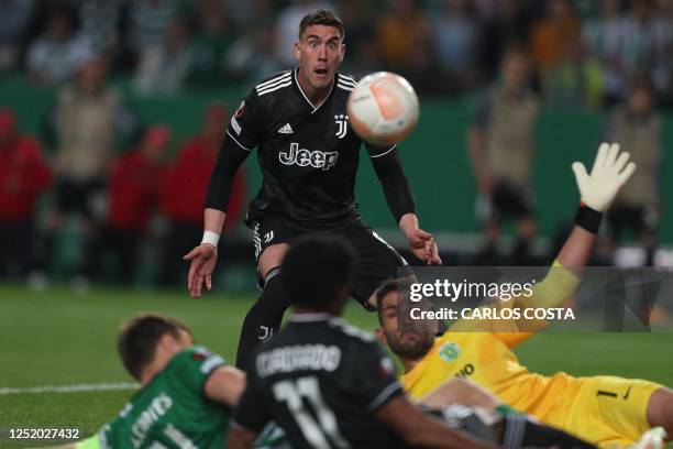 Juventus' Serbian forward Dusan Vlahovic eyes the ball during the UEFA Europa league quarter final second leg football match between Sporting CP and...