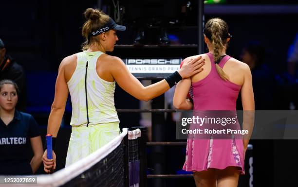 Beatriz Haddad Maia of Brazil and Elena Rybakina of Kazakhstan shake hands at the net after Rybakina is forced to retire due to injury in second...