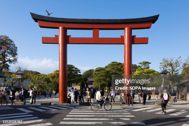 Pedestrians wait for a green light in front of Tsuruoka Hachimangu shrine. After three and a half years of Covid-19 pandemic, international tourists...