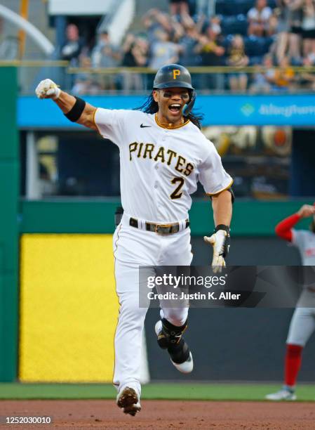 Connor Joe of the Pittsburgh Pirates reacts after hitting a three-run home run in the first inning against the Cincinnati Reds at PNC Park on April...